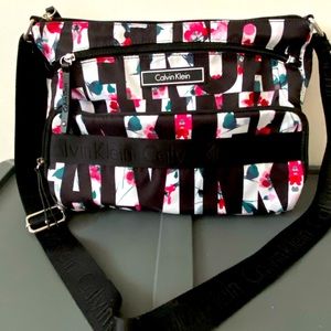 Calvin Klein multi floral and black & white purse.